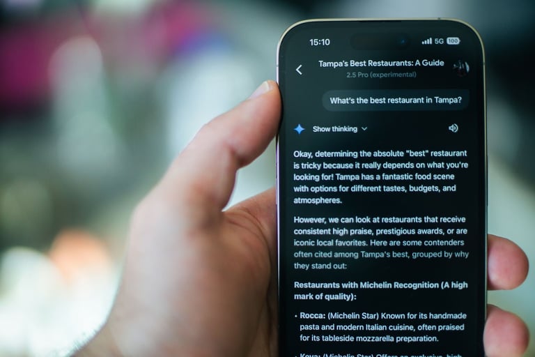 Hand holding smartphone displaying a guide about Tampas best restaurants with ratings and reviews